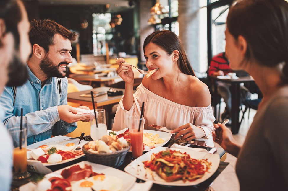 People eating and social distancing.